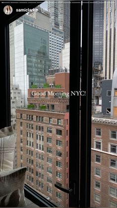 the view from an apartment in new york city, looking out at buildings and skyscrapers