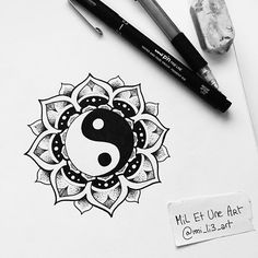 a pen and some ink on paper with a drawing of a ying - pei symbol