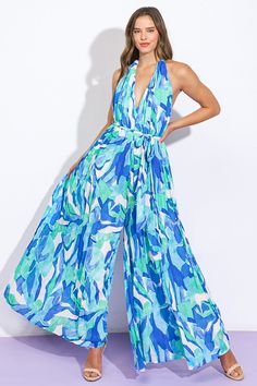 A printed woven jumpsuit featuring plunging V halter neckline, sleeveless, wide leg, self sash tie and bare backDetails:Self : 100% PolyesterLining : 100% PolyesterSize & Fit- Model is 5`8" And Wearing Size Small- Measurements Taken From Size Small- Approx. Length: 58" Blue Sleeveless Tie Back Jumpsuit, Blue Halter Neck Jumpsuits And Rompers For The Beach, Summer Halter Neck Jumpsuits And Rompers With Tie Back, Blue Halter Neck Jumpsuit For Beach, Summer Halter Neck Jumpsuit With Tie Back, Beachwear Halter Neck Jumpsuits And Rompers For Vacation, Halter Neck Jumpsuits And Rompers For Beach Vacation, Halter Neck Jumpsuits And Rompers For Vacation, Blue Summer Halter Neck Jumpsuits And Rompers