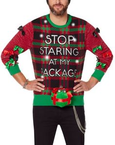 a man wearing an ugly christmas sweater with the words stop staring at my package