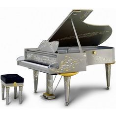 a grand piano sitting next to a stool and footstool on a white background