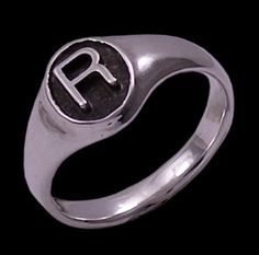 Block Style Font Initial Monogram 'Signet' Ring   The block style initial font 'signet' ring has been cast in solid sterling silver and then had a raised sterling silver initial soldered into place. The top oval measures 10 mm x 8 mm and has been oxidized to a black patina. The entire band has been polished to a lustrous, mirror shine.   The ring is also available with a dimond burr textured, shimmering silver background or a script style initial font.  Please view the other style in my shop htt Initial Fonts, Silver Background, Nissan Logo, Sterling Silver Initial, Initial Monogram, A Script, S Monogram, Block Style, Monogram Initials