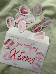 a piece of paper that says you miss my kisse on top of some stickers