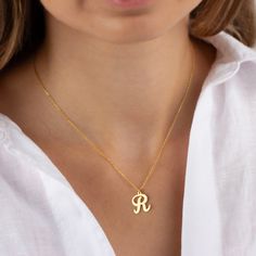 A letter necklace is a piece of jewelry that features a pendant or charm in the shape of a specific letter of the alphabet. It is a popular choice for personalized jewelry, allowing individuals to wear their own initial or the initial of a loved one. Letter necklaces can be made from various materials, but a gold letter necklace is particularly sought after for its elegance and durability. It can be a meaningful and stylish accessory that adds a personal touch to any outfit. ► PRODUCT DETAILS * Dainty Personalized Initial Necklace, Affordable Elegant Letter Initial Necklace, Mother's Day Charm Necklaces With Initials, Mother's Day Charm Necklace With Initials, Mother's Day Charm Necklaces With Initial Letters, Dainty Initial Letter Necklace, Elegant Letter Initial Necklace, Dainty Letter Charm Necklace With Initials, Dainty Initials Letter Charm Necklace