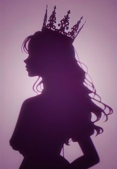 the silhouette of a woman with a crown on her head