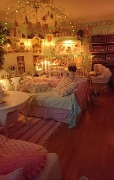 a living room filled with furniture and lots of lights on the ceiling above it's fireplace