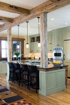 a large kitchen with an island in the middle