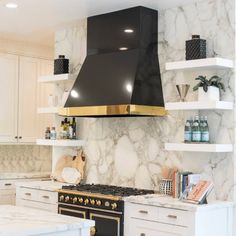 a stove top oven sitting inside of a kitchen next to white counter tops and cabinets