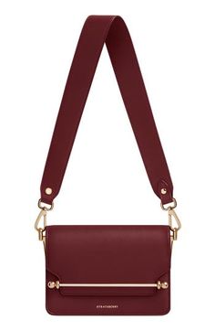 A wide shoulder strap updates this sought-after style crafted in Spain from burgundy-colored calfskin and secured with a signature bar closure. A chain crossbody strap offers another elegant way to carry this compact bag. Slip-flap closure Removable shoulder strap; removable chain crossbody strap Interior wall pocket Textile lining Leather Made in Spain Designer Handbags Compact Bag, Woman Bags Handbags, Interior Wall, Wall Pockets, East West, Crossbody Strap, Leather Shoulder Bag, Designer Handbags, Calf Skin