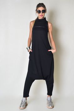 Extravagant black women's jumpsuit made of soft fabric fitted at the top and a zipper at the back. Fits astonishingly well in all sizes.  SHIPPING within 2-3 DAYS MATERIAL: 50% High-Quality Cotton, 50% Polyester AVAILABLE SIZES: - XS, S, M, L, XL, and extra-large: 2X, 3X, 4X - View the size chart photo above DETAILS: This jumpsuit is perfect for all occasions - weddings, gatherings, and hanging out This piece has been carefully designed in my small studio in the heart of Sofia-Capital. Take a look at the other items in my shop and please let me know what you think https://www.etsy.com/shop/wearekvs Thanks for stopping with wearekvs! Black High Neck Jumpsuits And Rompers, Women Romper, Rocker Outfit, Stylish Jumpsuit, Womens Jumpsuits, Cotton Jumpsuit, Rock Chic, Street Style Chic, Jumpsuit With Sleeves