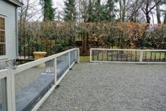 a fenced in area next to a house