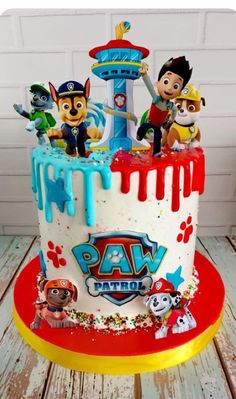 a birthday cake with paw patrol characters on it