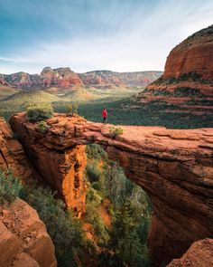 a person standing at the edge of a cliff