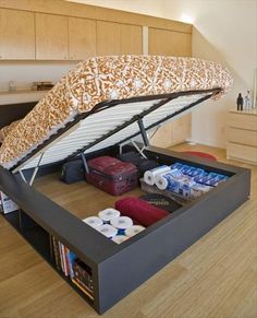 a bed with an open box underneath it