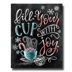 a chalkboard sign with the words, fill your cup with joy and a mug filled with hot chocolate