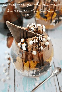 a dessert in a jar with marshmallows and chocolate