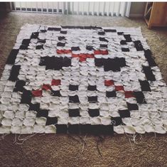 a large piece of cloth that has been made into a crossword puzzle on the floor