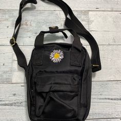 Black Daisy Embroidered Bag Brand New With Tag Trendy Shoulder Bag With Embroidered Logo For Daily Use, Casual Shoulder Bag With Embroidered Logo For Travel, Casual Travel Shoulder Bag With Embroidered Logo, Black Shoulder Bag For Spring, Trendy Embroidered Backpack, Everyday Black Embroidered Bag, Trendy Everyday Bag With Embroidered Logo, Trendy Shoulder Bag With Embroidered Logo, Trendy Shoulder Bag With Embroidered Logo For Everyday Use