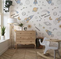 a child's room with space themed wallpaper