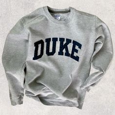 Light Gray minimal, vintage Duke Sweatshirt Classic Winter T-shirt With Relaxed Fit, Classic Cotton Sweatshirt With Letter Print, Classic College Sweatshirt With Letter Print, Classic Letter Print Sweatshirt For College, Classic Letter Print Tops For College, Classic Winter Sweatshirt With Letter Print, Classic Gray Crew Neck Sweatshirt, Classic Relaxed Fit Tops For College, Classic Crew Neck Tops With Letter Print