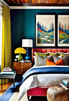 a bedroom decorated in blue, orange and yellow