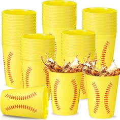 a bunch of yellow cups with baseball designs on them