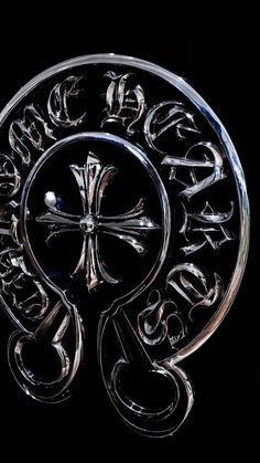 a glass plate with an ornate design in the center on a black background is shown