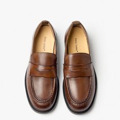 These penny loafers are crafted from soft calfskin, providing a luxurious feel and classic look. They are the perfect addition to any wardrobe, whether dressing up for a business meeting or dressing down for a casual outing. With their simple yet elegant design, these loafers are both timeless and versatile. Upper Material: Calfskin Lining Material: Pigskin Outsole Material: Rubber Insole Material: Cow Leather Closure Type: Slip-on Heel height: 2.5cm Loafers Women, Leather Loafers Women, High Heel Sneakers, Formal Loafers, Brown Loafers, Custom Made Clothing, Saddle Brown, Business Meeting, Boot Pumps