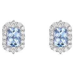 This collection features an array of aquamarines with an icy blue hue that is as cool as it gets! Accented with diamonds these Stud Earrings are made in white gold and present a classic yet elegant look. Aquamarine stud Earrings in 18Karat White Gold with White Diamond. Aquamarine: 1.616 carat, 7X5mm size, cushion shape. White Diamond: 0.163 carat, 2.20mm size, round shape, G color, VS clarity. White Diamond: 0.125 carat, 1.6mm size, round shape, G color, VS clarity White Diamond: 0.225 carat, 1 Blue Halo Diamond Earrings Luxury Style, Silver Blue Topaz Earrings With Brilliant Cut, Silver Earrings With Brilliant Cut Blue Topaz, Aquamarine Studs, Diamond Tiara, Butterfly Pin, Purple Sapphire, Naha, Icy Blue