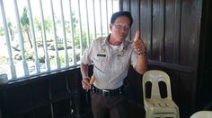 a police officer giving the thumbs up sign