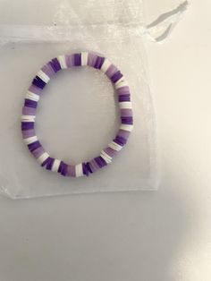 Purple handmade beaded bracelet Purple Beaded Heishi Beads Bracelets, Purple Heishi Beaded Bracelets, Purple Heishi Beads Round Bracelets, Trendy Beaded Round Friendship Bracelets, Trendy Round Beaded Friendship Bracelets, Colorful Heishi Beads Bracelet, Handmade Casual Heishi Beads Bracelets, Handmade Purple Stretch Bracelet For Beach, Trendy Handmade Purple Wristband