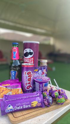 an assortment of snacks and drinks on a table