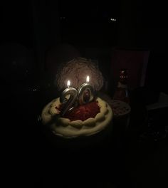 a birthday cake with two candles on it