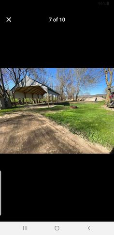 an image of a dirt road in front of a building