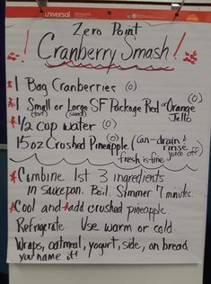 a sign posted on the wall in front of a door that says, zero point cranberry smash