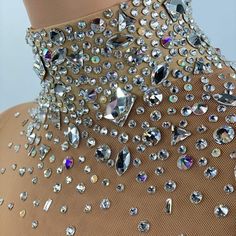 a dress with lots of crystals on it