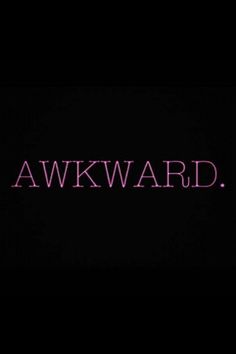 the words awkward are lit up against a black background with pink letters on it