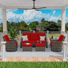 a red couch sitting on top of a wooden deck