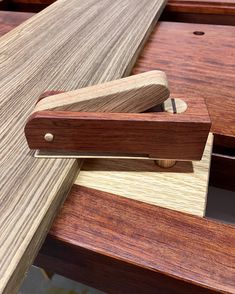 a close up of a wooden object on a table