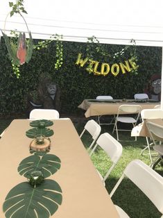 an outdoor party with tables, chairs and decorations