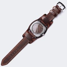 "WW2 Military Pilot Bund Strap - Antique Brown FEATURES -Compatible with all watches between 18mm and 24mm lug width. -Double layered leather construction -Standard Length: 80mm/125mm - 3.1\"/ 4.9\" -Thickness: 1.6-1.8mm -316L Stainless steel buckle included. -Durable waxed thread -Handmade and hand stitched *Measure the buckle and lug width (the width between the area where your watch strap fits) and select the right size. *When that extra piece-bund is removed, the strap becomes classic two-pi Timeless Watch With Bracelet Strap For Everyday, Timeless Watch Bands With Bracelet Strap For Daily Use, Timeless Bracelet Strap Watch Bands For Everyday Use, Timeless Everyday Watch With Bracelet Strap, Vintage Watches With Bracelet Strap For Everyday Use, Brown Watch With Bracelet Strap And Round Dial, Brown Watch Bracelet Strap With Round Dial, Classic Round Watch Band With Bracelet Strap, Vintage Watch Accessories With Bracelet Strap For Everyday Use