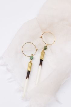 Made by the same makers as the earrings seen in Yellowstone Season 5 Episode 3, worn by character Beth Dutton (Kelly Reilly), these earrings consist of natural porcupine quills* set in recycled .22 bullet casings hung from 1” brass hoops, complete with American turquoise stones. Shop the Beth Dutton Collection. SIZE: The earring length is measured from the tip of the quill to where the turquoise connects to the hoop. Each pair will vary in length. On average the earrings are between 2" to 3.5" l Yellowstone Season 5, Porcupine Quill Earrings, Quill Earrings, Kelly Reilly, Linen Candle, Beth Dutton, Porcupine Quills, Turquoise Hoop Earrings, Bullet Casing