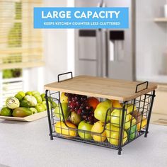 a basket filled with lots of fruit sitting on top of a counter