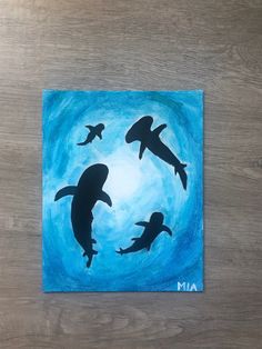 an acrylic painting of two dolphins swimming in the ocean