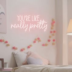 there is a neon sign that says you're like really pretty on the wall