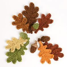 four crocheted leaves are shown in three different colors, one brown and one green