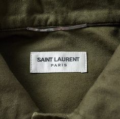 saint laurent paris label on an olive green jacket