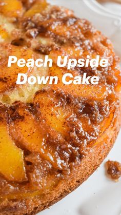 a close up of a cake on a plate with the words peach upside down cake