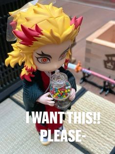 an action figure holding a gummy ball in his hand with the caption i want this please