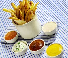 french fries and dipping sauces on a table